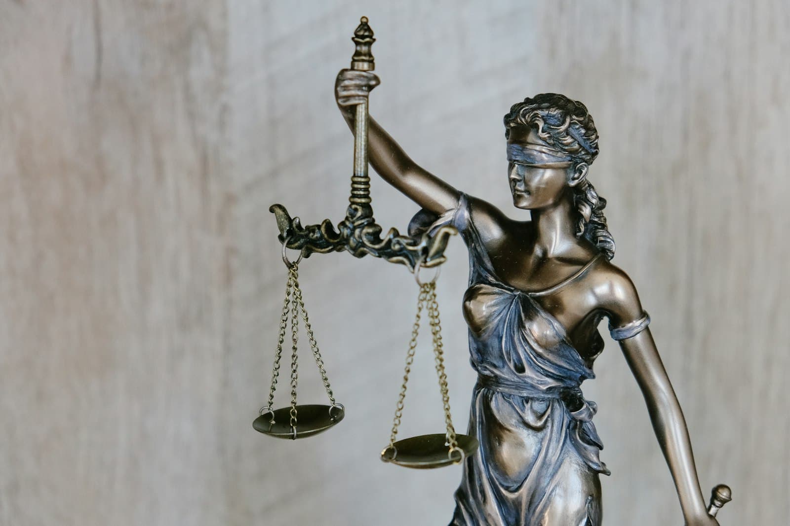 Bronze statue of Lady Justice holding the scales